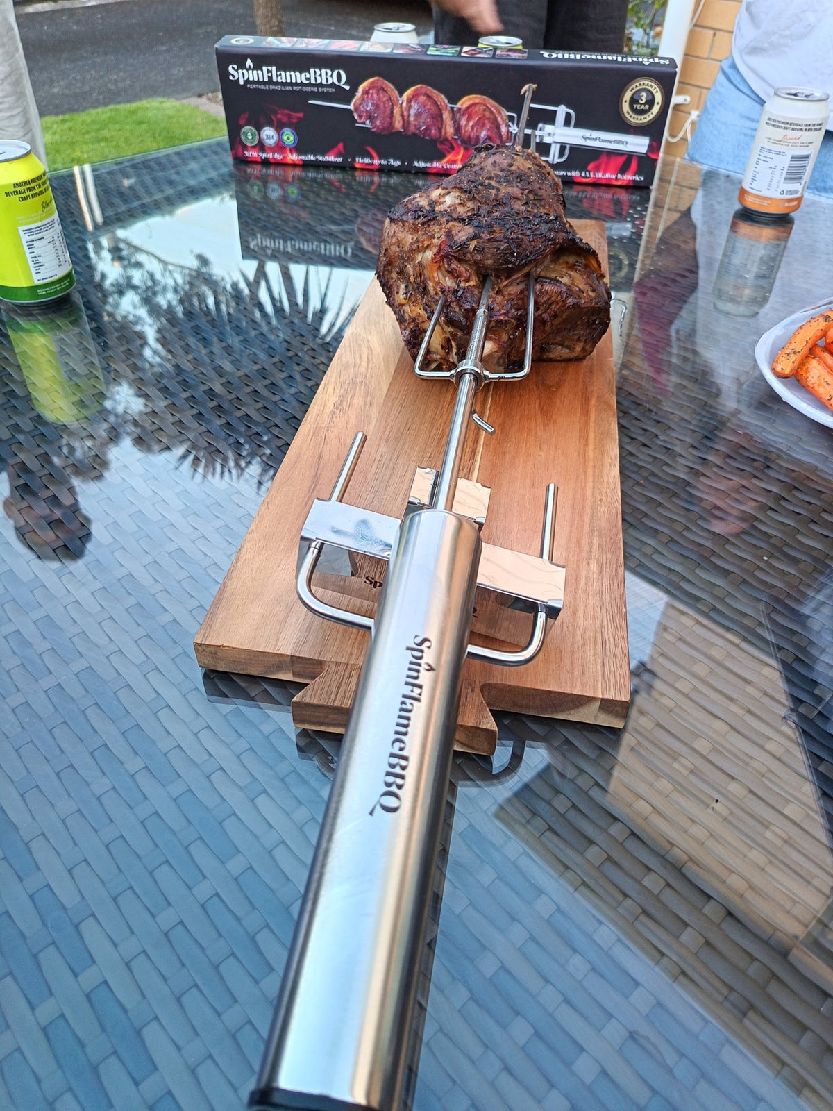 SpinFlameBBQ rotisserie mounted on a kettle outdoors